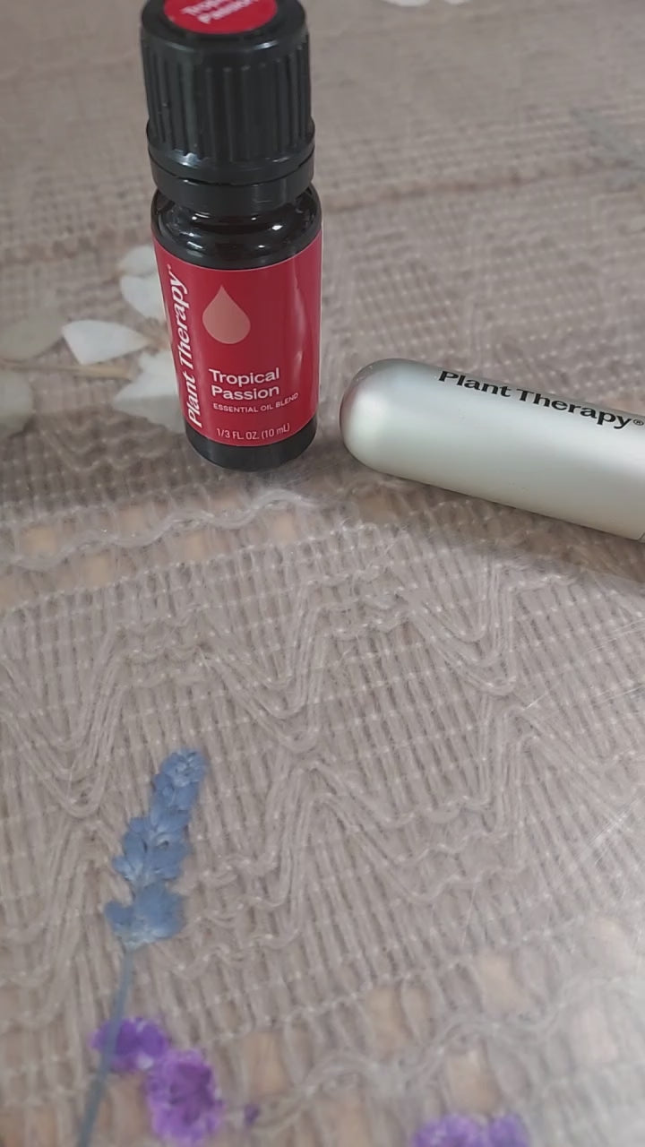 Short video showing the Tropical Escape essential oil & aromatherapy inhaler — paired together as a summer wellness set. Close‑up movement highlights the textures and packaging for a bright, tropical presentation.ed